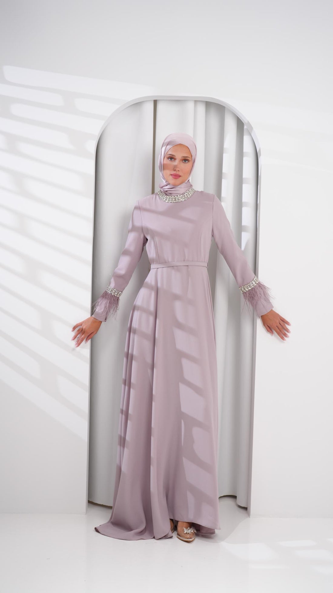 purple abaya dress with feather and crystals on sleeves