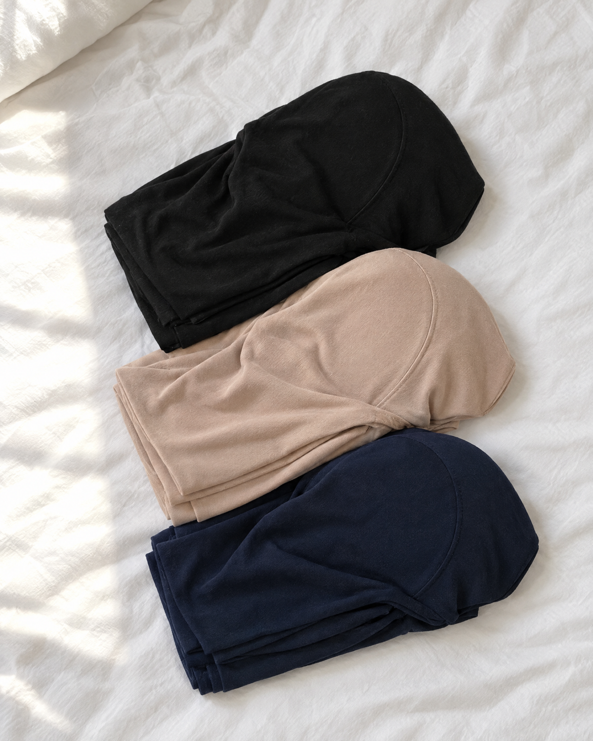 Zolaykha full hijabs folded in black, nude and navy