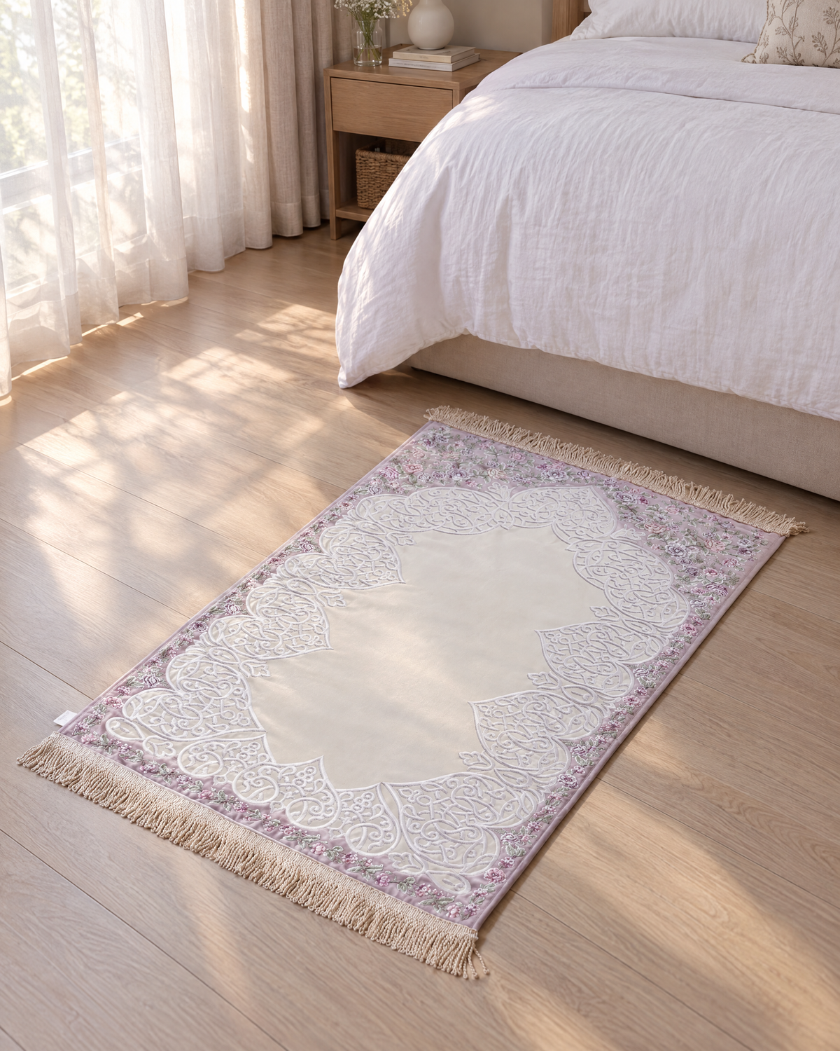 Satin padded Floral Arabesque prayer mat at the foot of a bed